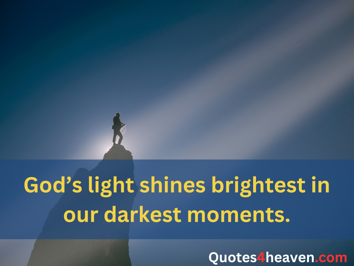 The image shows a person standing on the peak of a mountain, illuminated by a bright ray of light breaking through the darkness. Overlaid on the image is an inspirational quote: "God’s light shines brightest in our darkest moments."